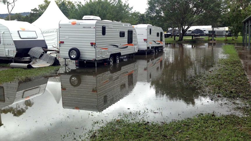 Water covers the ground at the camping and caravan show at Mudgeeraba showgrounds.