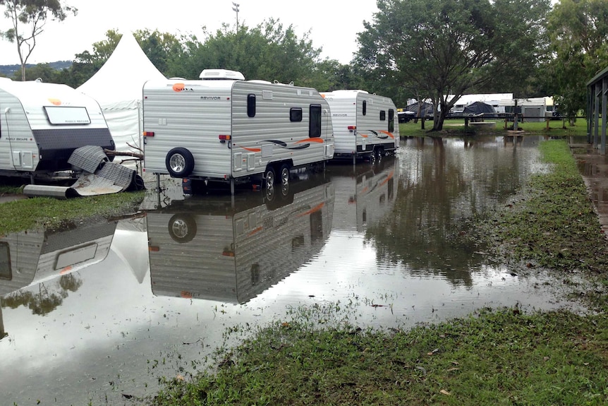 Water covers the ground at the camping and caravan show at Mudgeeraba showgrounds.
