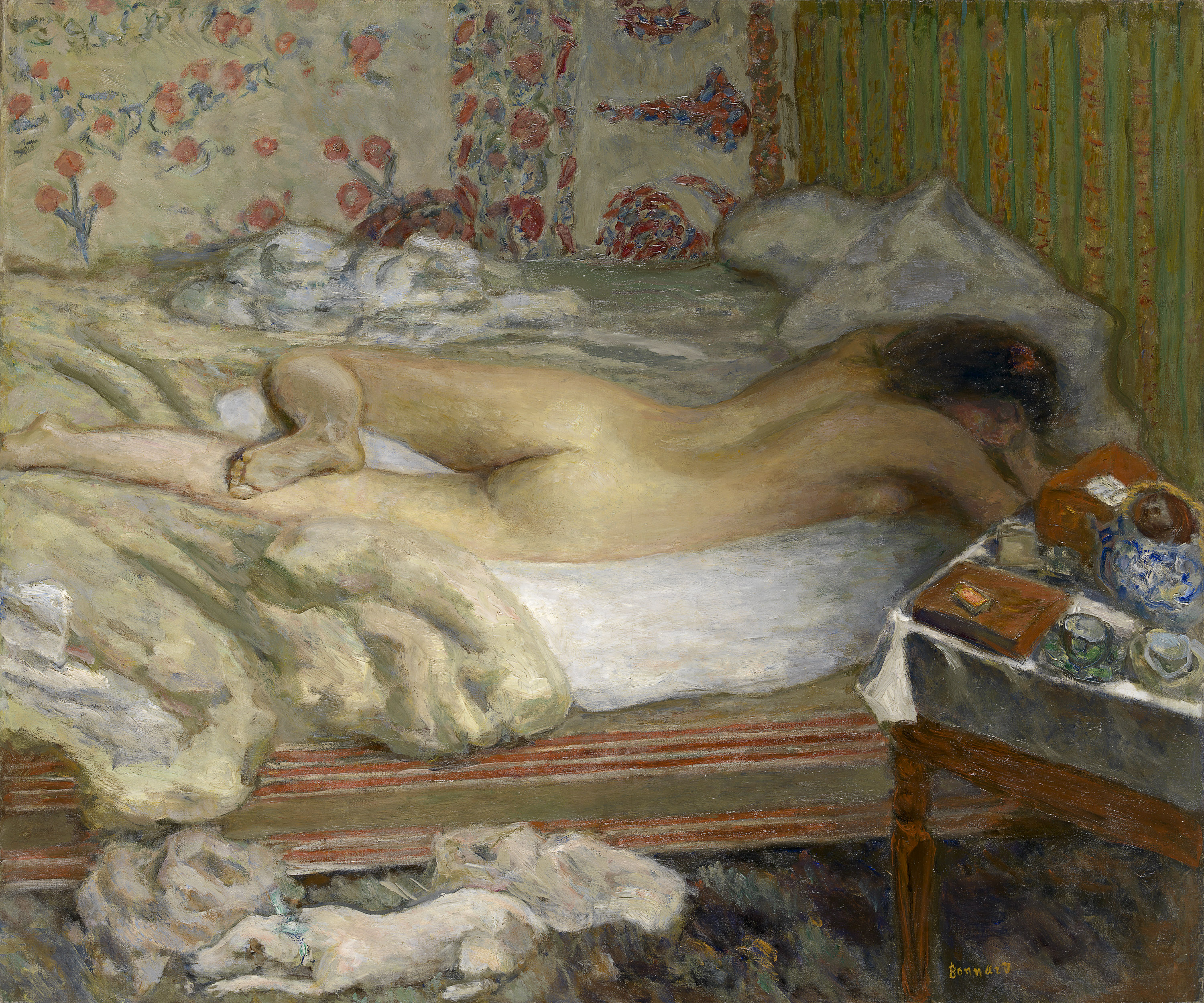 Oil painting showing a woman lying, supine and nude, on a mattress. A small white dog is on the floor.