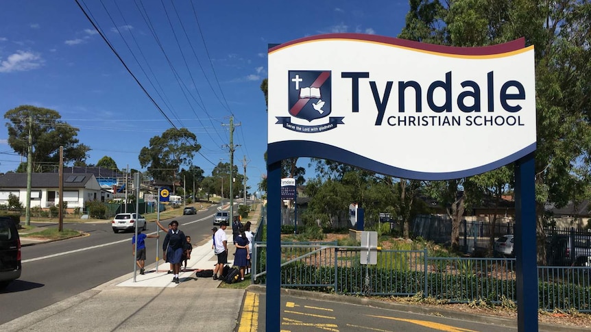 A sign saying "Tyndale Christian School".