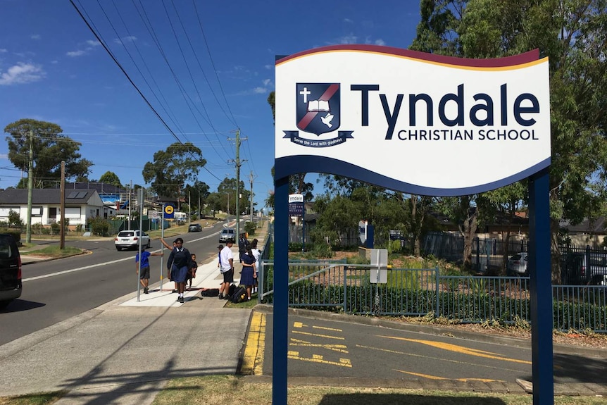 A sign saying "Tyndale Christian School".