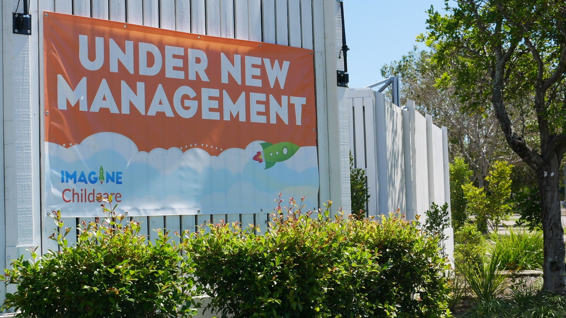 Imagine childcare sign reading under new management.