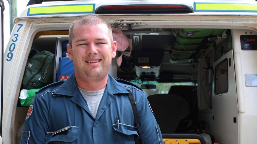 Coen paramedic Anthony Schomaker stands in front of his ambulance in the small far north Queensland town.