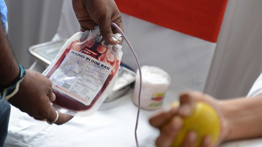 A man donates blood.