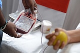 A man donates blood.