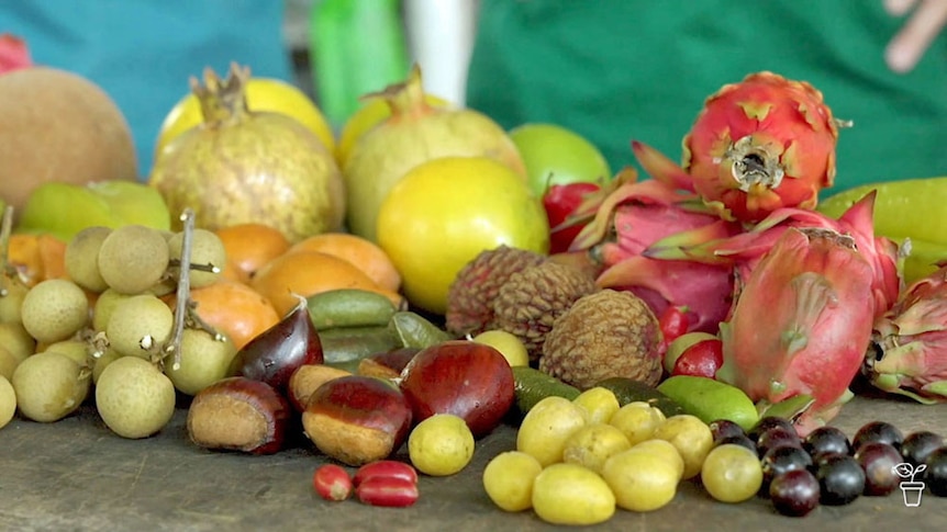 A selection of tropical fruits on a table.