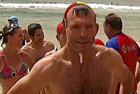 Can Afghan refugee Riz Wakil teach Tony Abbott about refugee experience during their surfing lesson? (ABC TV)