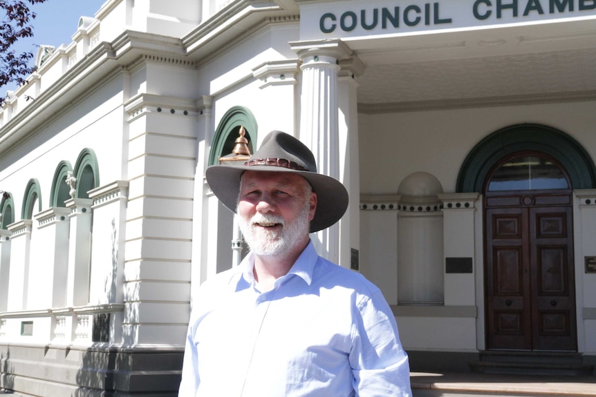 Man standing in front of Wagga's Historic Council Chambers