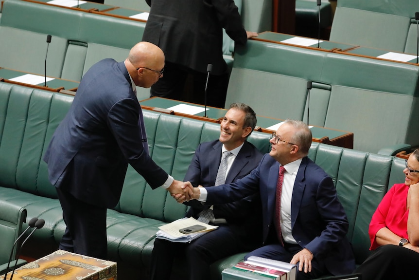 Anthony Albanese and Australian Opposition Leader Peter Dutton shake hand.