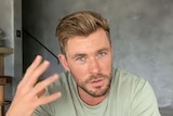 Still of Australian actor Chris Hemsworth talking in a online video.