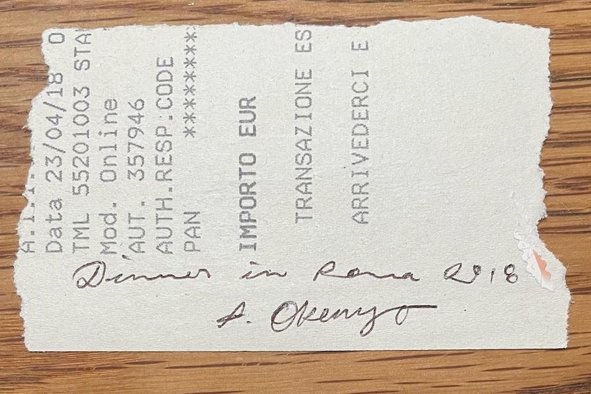 A handwritten note on an Italian restaurant receipt, that says 'dinner in Roma, 2018, A Okenyo'