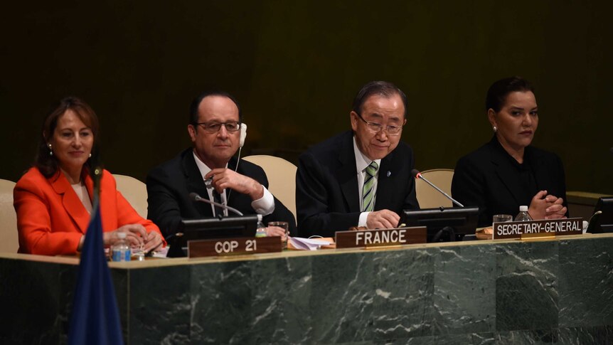 France's President Francois Hollande sits with United Nations-Secretary General Ban Ki-moon.