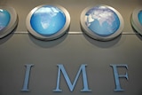 The IMF nameplate is displayed on a wall