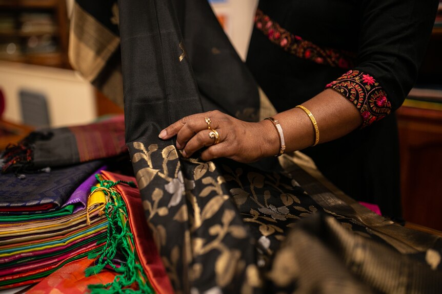 Chandrasekaran holding a sari