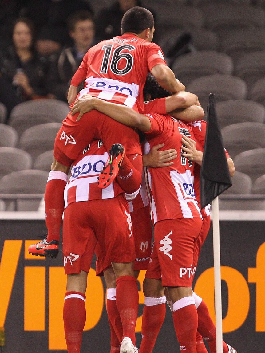 Derby triumph ... The Heart celebrate a goal against the Victory