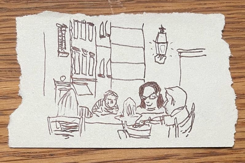 A black ink sketch of a family dining at a restaurant