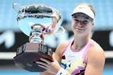 Diede de Groot of the Netherlands poses with the Australian Open trophy after winning the women's wheelchair singles final.
