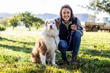 A border collie dog and a woman 