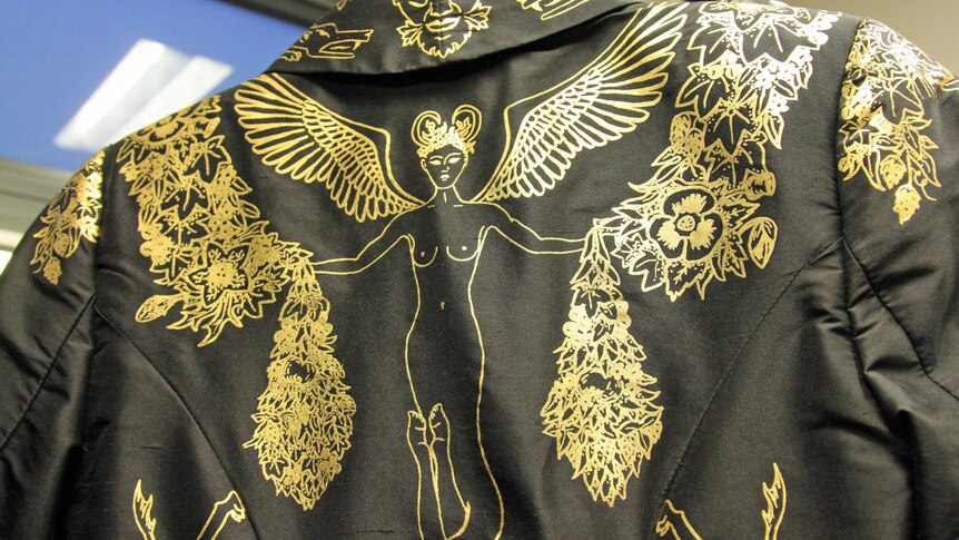 Detail of gold design on black jacket