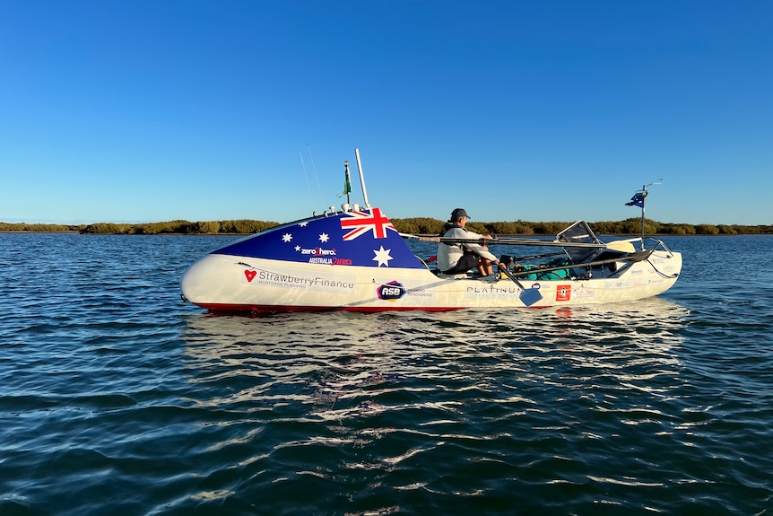 A man rowing on the water in a boat