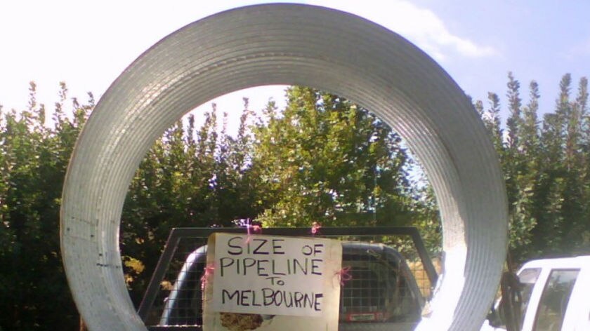 Protesters opposed to the north-south pipeline march on farm where pipe is being laid.