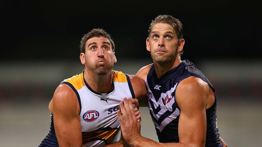 Aaron Sandilands wrestles Dean Cox