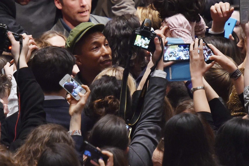 US singer Pharrell Williams mobbed after UN speech