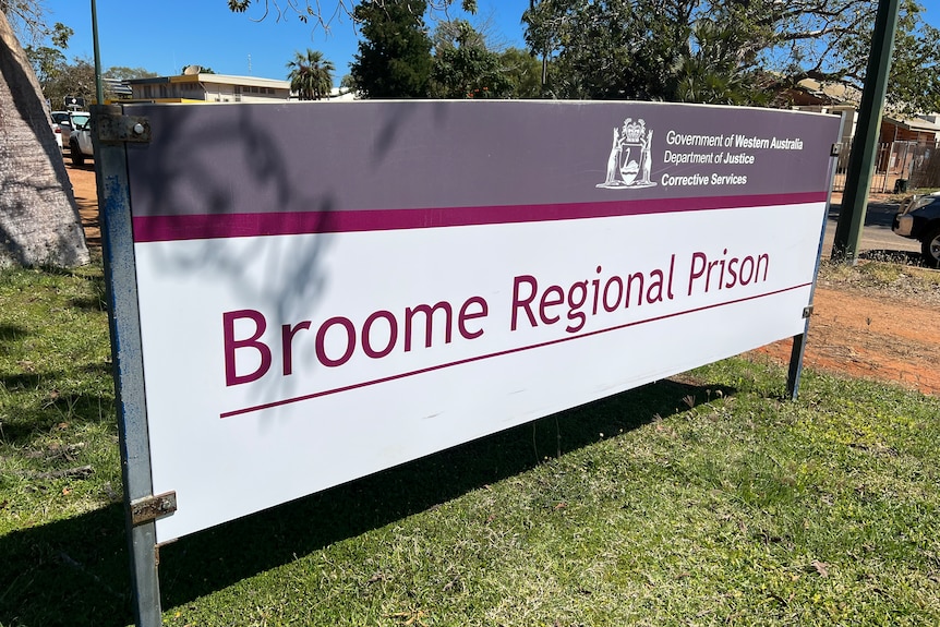 A large sign that reads 'Broome Regional Prison', on a grass
