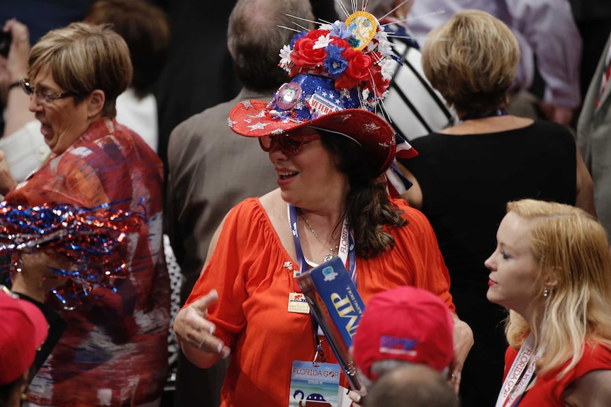A Florida delegate dances at the start of the third day of the Republican National Convention.