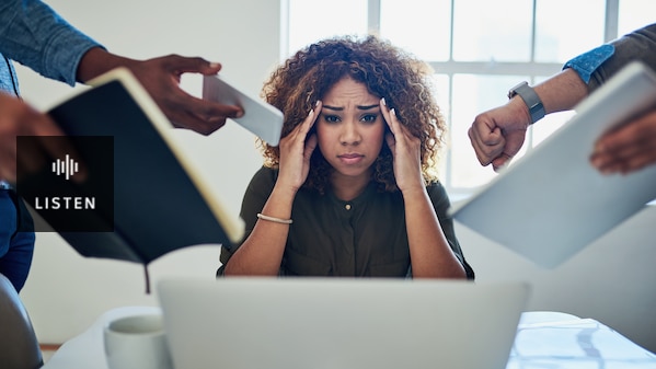 stressed female worker looking overwhelmed with things shoved in her face like a phone, diary and watch. Has Audio.