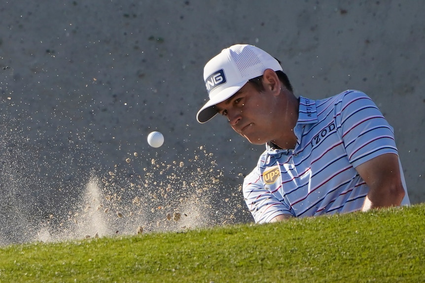 Louis Oosthuizen hits out of the bunker