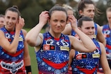 Daisy Pearce leads the Narrm Demons out during indigenous round. She is pictured wearing her indigenous guernsey 