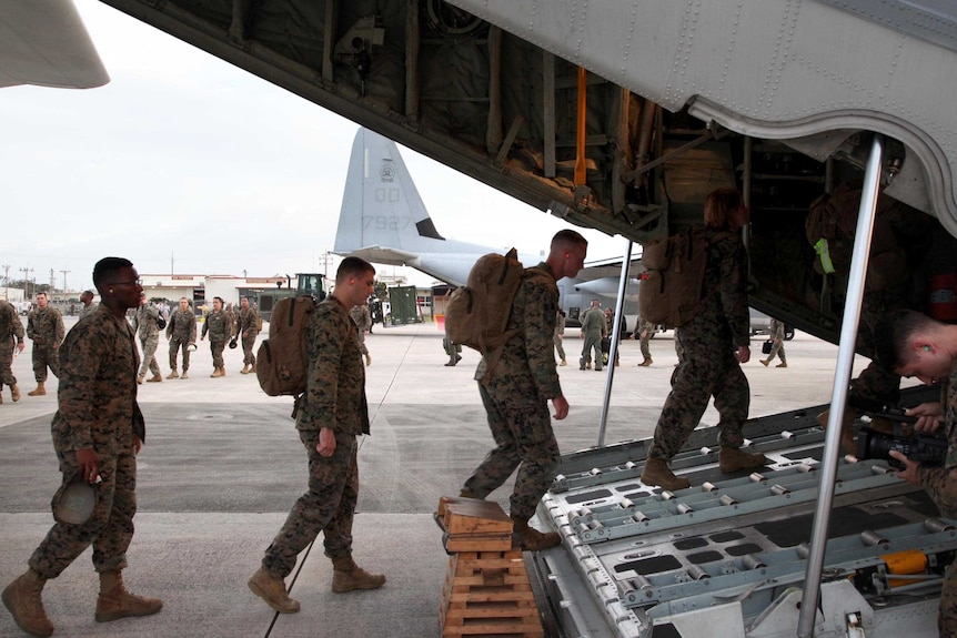 US Marines board a Hercules en route to the Philippines in the wake of Typhoon Haiyan.