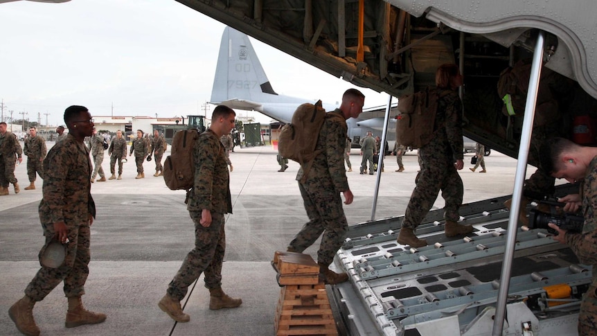 US Marines board a Hercules en route to the Philippines in the wake of Typhoon Haiyan.