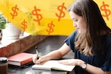 Woman with money signs above her journalling in a notebook to depict getting back on track with your savings