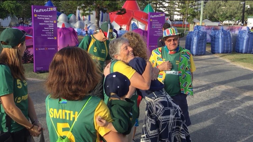 Priscilla Smith gives Genevieve Bishop a hug of thanks, after she donated Commonwealth Games tickets