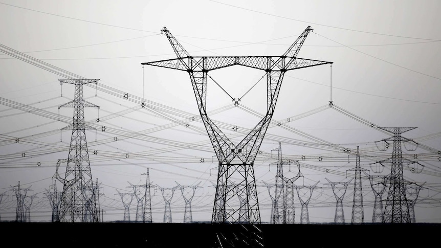 High voltage power lines are seen near a wind farm in Guazhou, Gansu Province in China on September 15, 2013.