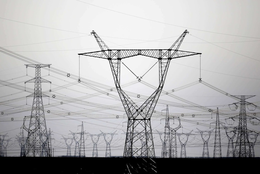 High voltage power lines are seen near a wind farm in Guazhou, Gansu Province in China on September 15, 2013.