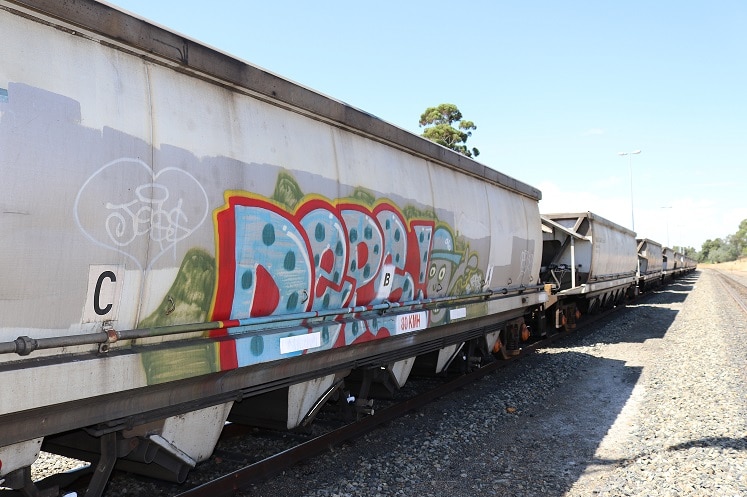 Coal trains run through the centre of town in Collie, where the industry is embedded in the community.