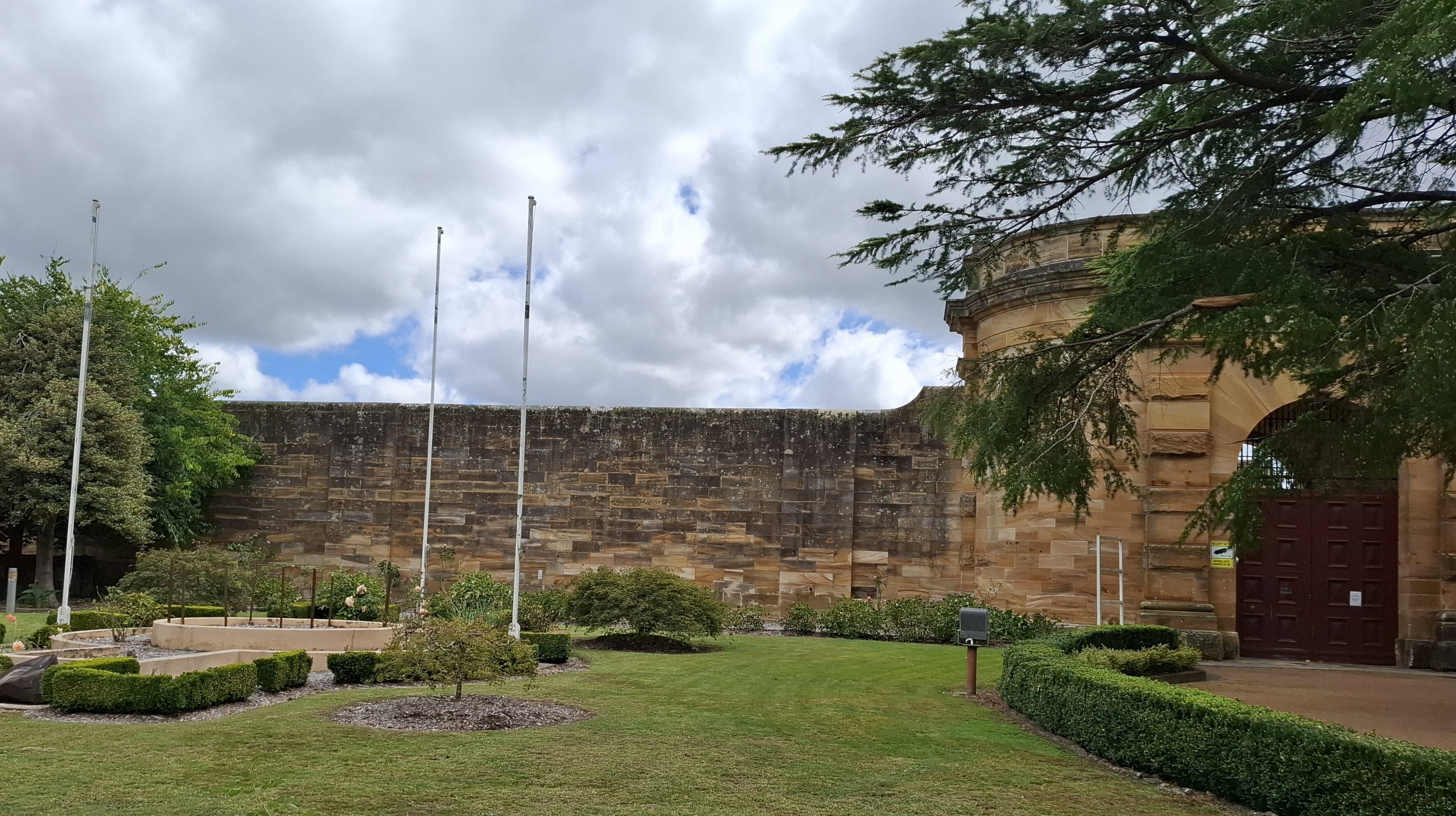 Sandstone walls and fence of former jail