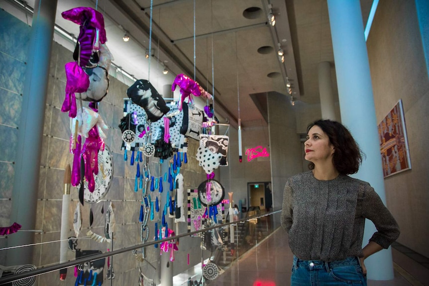 Artist Sarah Contos stands in front of her work called Nikola Tesla sends Theda Bara to Mars