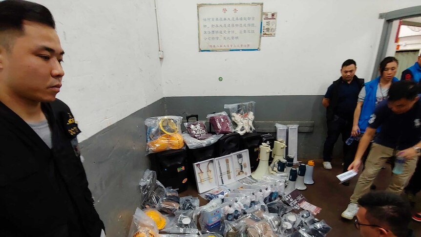 Confiscated equipment and weapons are displayed by Hong Kong police.