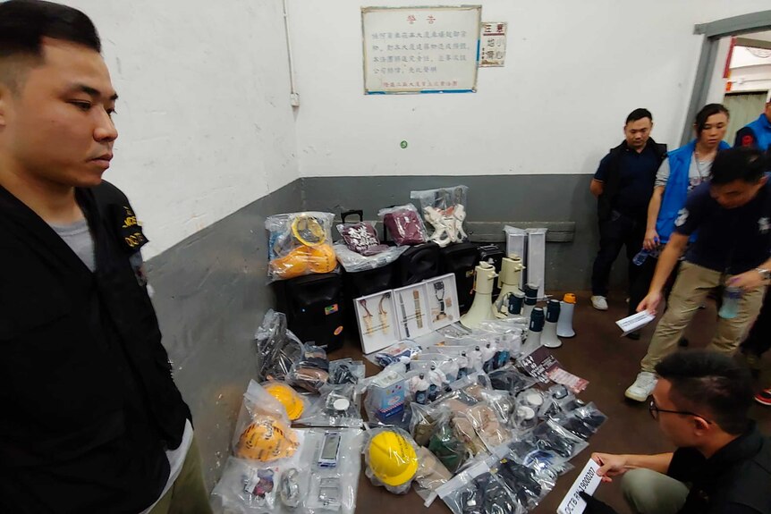 Confiscated equipment and weapons are displayed by Hong Kong police.