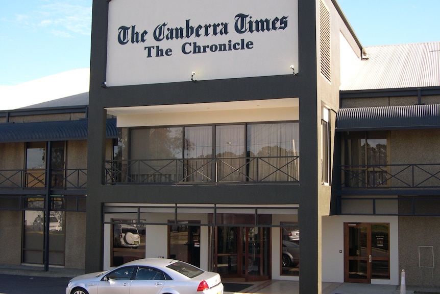 A shopfront with "The Canberra Times" and beneath that, "The Chronicle" emblazoned on it.