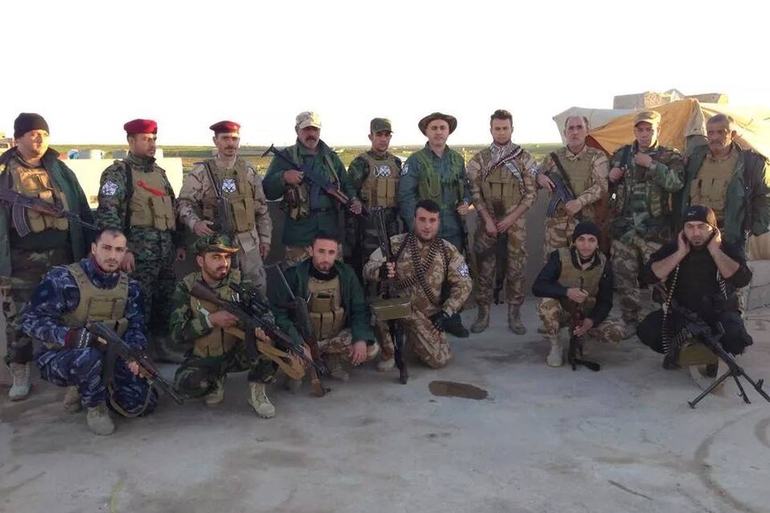 Khamis Gewargis Khamis with militia fighters in northern Iraq