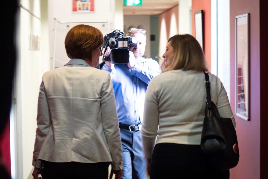 Meegan Fitzharris walking out of ABC studios in Canberra