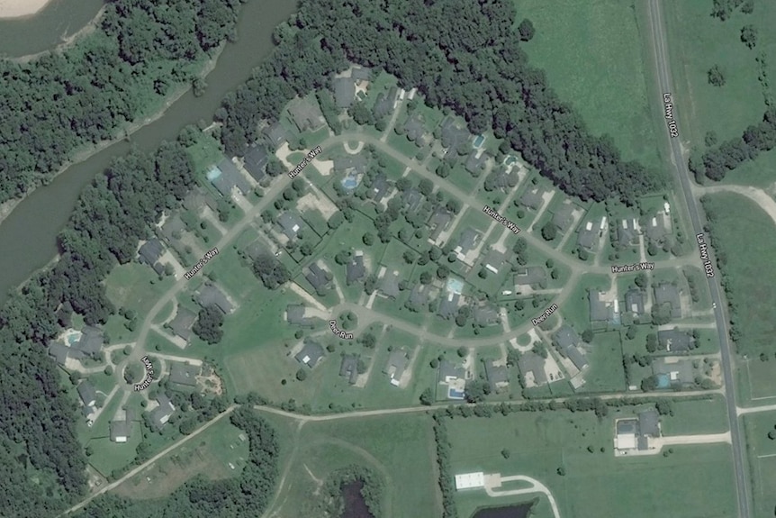 Satellite imagery shows a riverside housing estate near Baton Rouge.