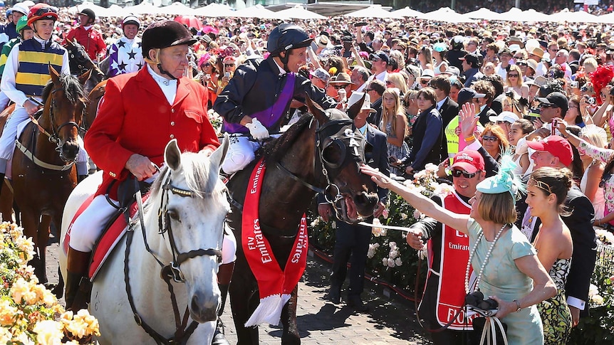Trainer Gai Waterhouse (R) pats Fiorente after Damien Oliver rode him to Melbourne Cup victory.
