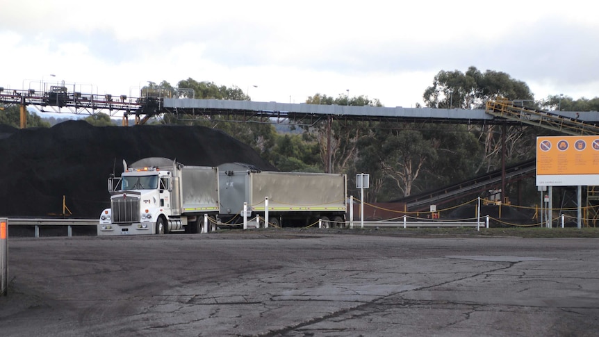 Mine truck and conveyor belt.