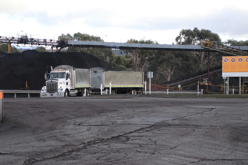 Mine truck and conveyor belt.